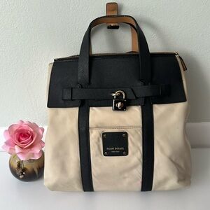 Henri Bendel Jetsetter Mini Convertible Backpack In Beige and Black.